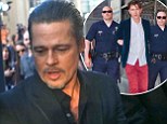 Violent scuffle as Brad Pitt is targeted by serial red carpet prankster Vitalii Sediuk at Maleficent premiere