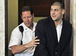 Hernandez is led into court in Attleboro, Mass., last August