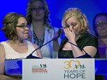 Emotional moment: On the one-year anniversary of their escape, Amanda Berry, right, wipes tears from her eyes with Georgina DeJesus by her side as they are honored at the National Center for Missing and Exploited Children's Hope Awards dinner Tuesday