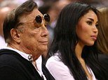 Damning recording: Donald Sterling (center) can be heard telling his girlfriend V. Stiviano (to his right) not to bring black people to Clippers games