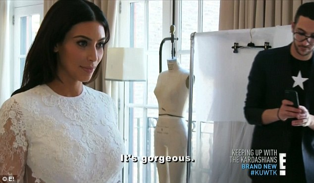 Thrilled: Kim couldn't stop staring at herself in the designer creation