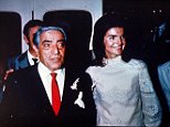 Aristotle Onassis stands with his new wife Jacqueline Kennedy after their marriage in the tiny chapel on the Island of Scorpios in Greece on Oct. 20, 1968.  Jackie and Aristotle are seen aboard the yacht  Christina.  (AP Photo)