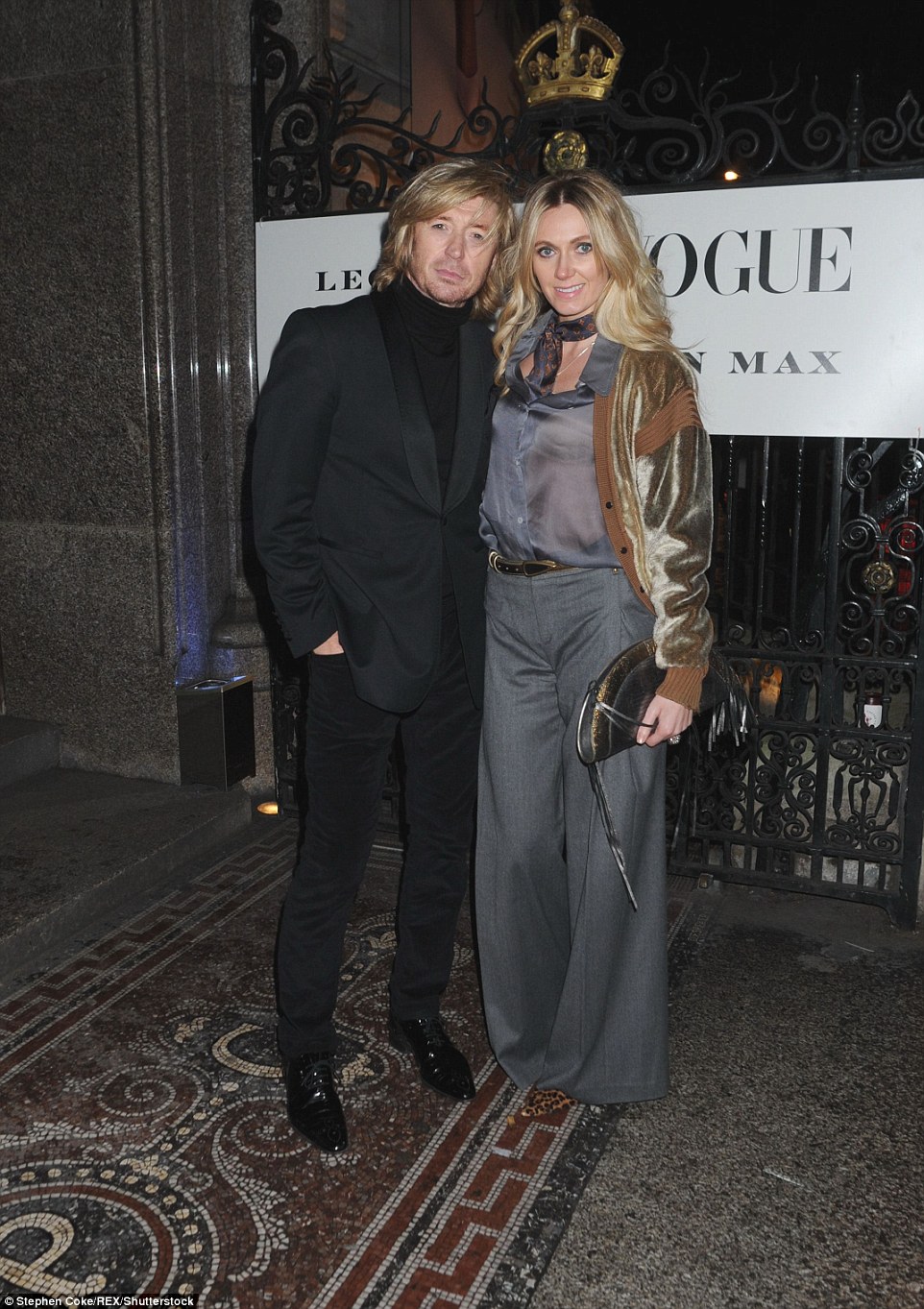 Hair-raising couple: Nicky Clarke looked handsome on the arm of his girlfriend Kelly Simpkin - both of whom naturally had flawless locks