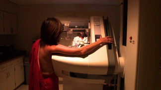 A patient gets a mammogram.