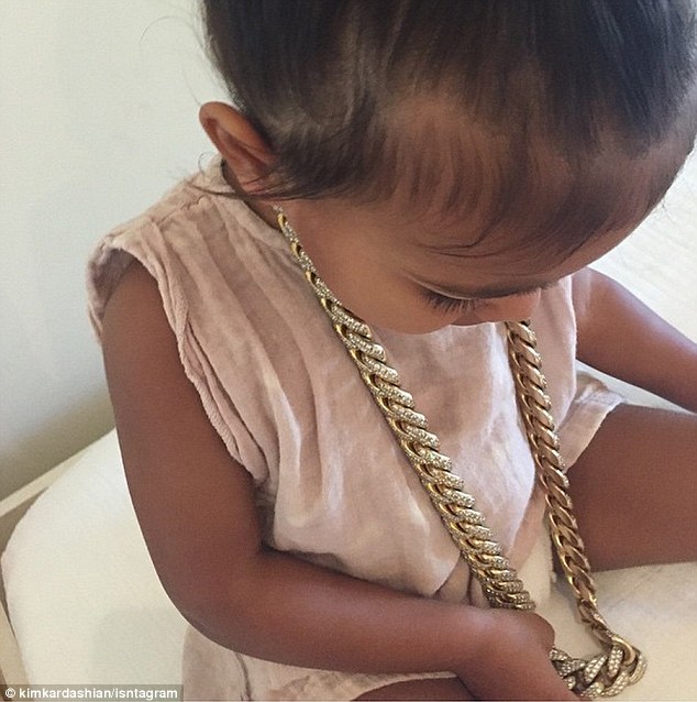 Cute: Earlier in the day, Kim shared a picture of her daughter North on Instagram wearing her dad Kanye West's thick gold chain