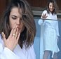 The stunning model popped out to the balcony of her luxury beachfront hotel in Rio de Janeiro, Brazil, in just her bathrobe and gave her fans below quite a treat.nnRef: SPL1292941  290516  nPicture by: Leo Marinho / Splash NewsnnSplash News and PicturesnLos Angeles: 310-821-2666nNew York: 212-619-2666nLondon: 870-934-2666nphotodesk@splashnews.comn