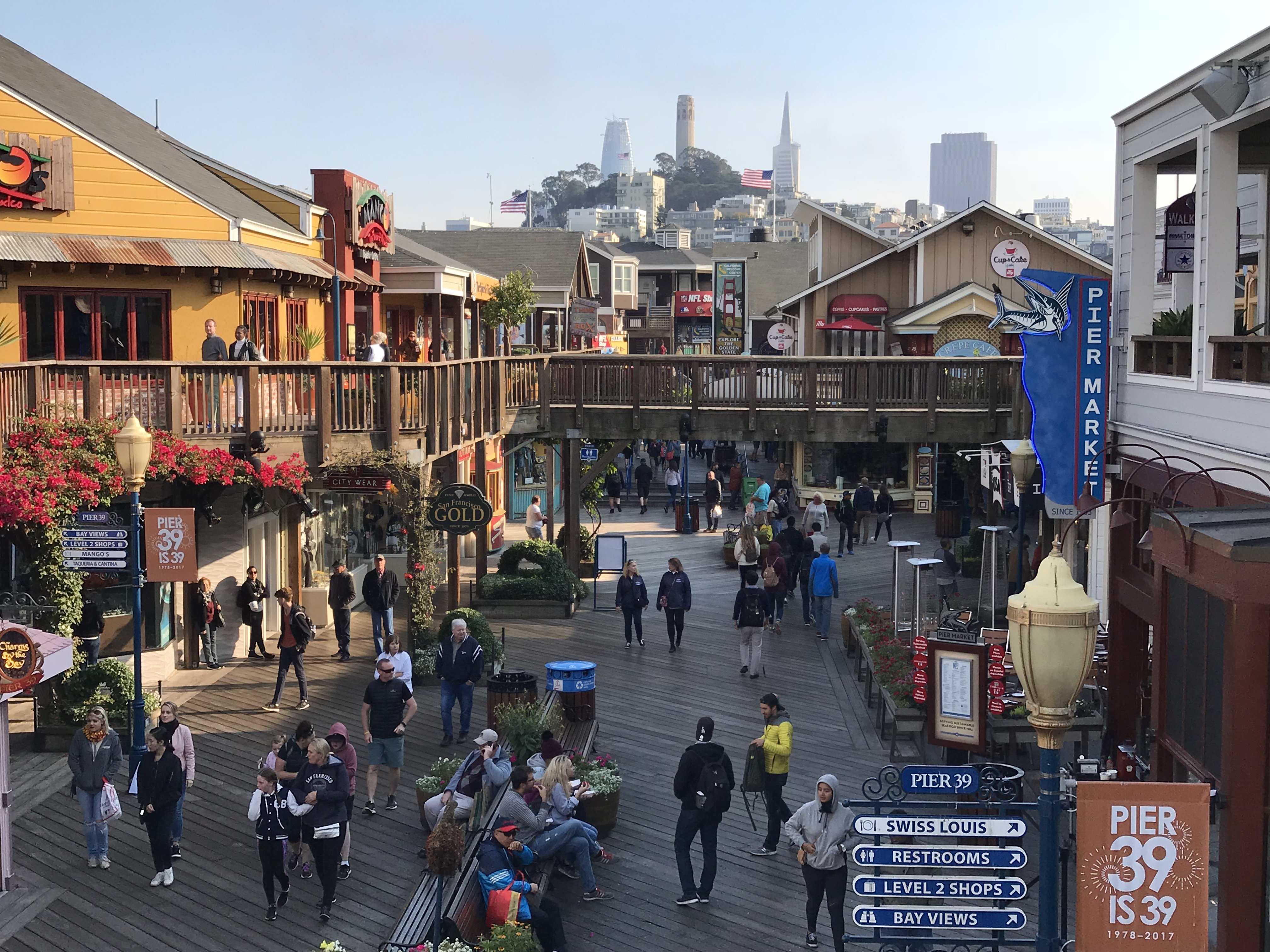 Coit tower and the Transamerica Pyramid are seen from Pier 39 at San Francisco's Fisherman Wharf on Oct. 18, 2017. (Credit: DANIEL SLIM/AFP/Getty Images)