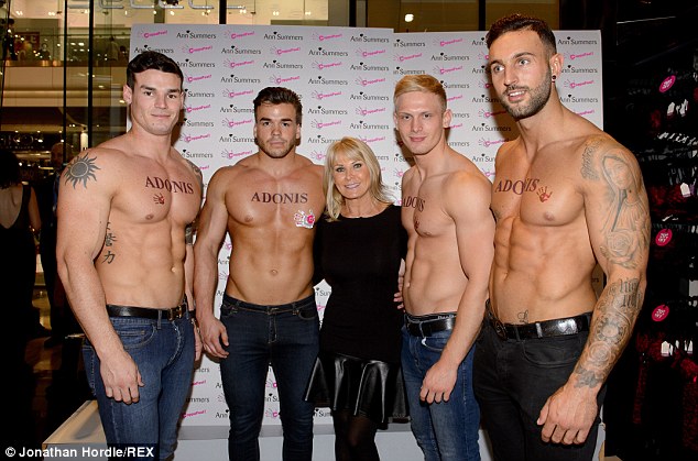 Woman in black: Mark Wright's mother Carol Wright beamed as she stood with four shirtless men