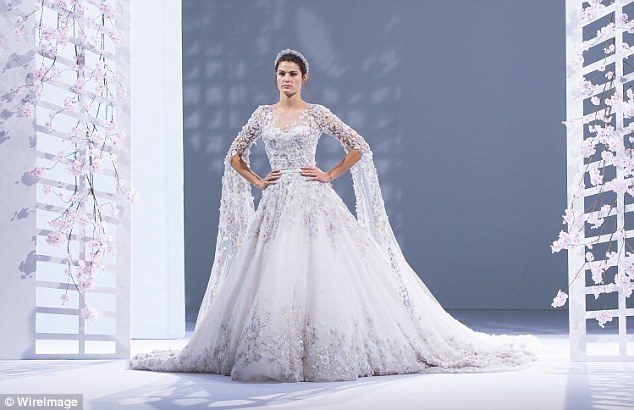 Super finale: Isabeli Fontana modelled the finale gown - a showstopping bridal dress with a three-metre train