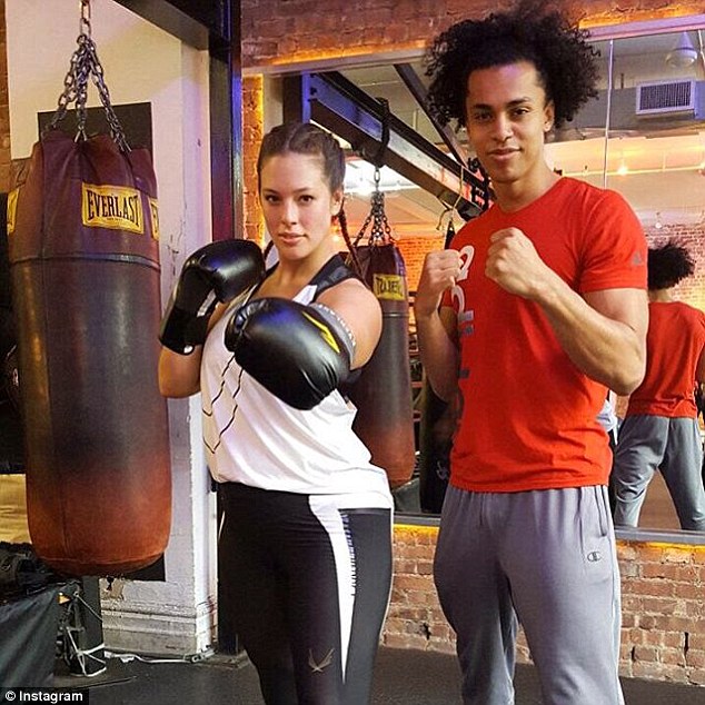 Role model: Ashley, who can be seen boxing with her trainer Christoper Kadima, is a body activist who encourages women to love their shape no matter what their size 