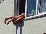 A nude woman sunbathing in the Austrian capital Vienna caused snarl ups on a major road when she positioned her naked body out of a window to get the maximum out of the sun's rays