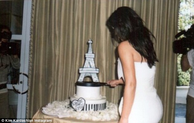 Cutting the cake: Kim posted Instagram shots from the shower including her cutting the cake