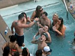 Jack's shame: Former Arsenal masseur Kieran Hunt pours champagne into Wilshere's mouth in Las Vegas