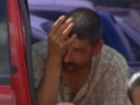 Overwhelmed: The girl's father can be seen sobbing inside the truck after the girl was found on Tuesday