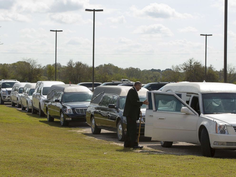 PHOTO: Hearses line up for the memorial service held at the Floresville Events Center on November 15, 2017 in Floresville, Texas for the nine members of the Holcombe family killed in the Sutherland Springs church shooting.