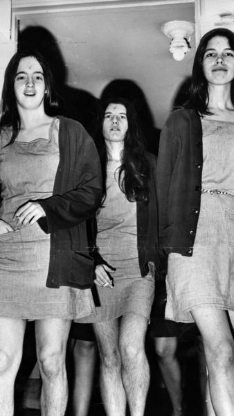 From left, Manson followers Susan Atkins, Patricia Krenwinkel and Leslie Van Houten walk into a morning court session in 1970. When Manson carved an X into his forehead during the trial, his family members followed suit.