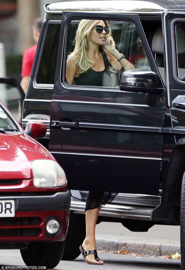 Best foot forward: Shunning her heels, Abbey wore a sensible pair of flat black thong sandals