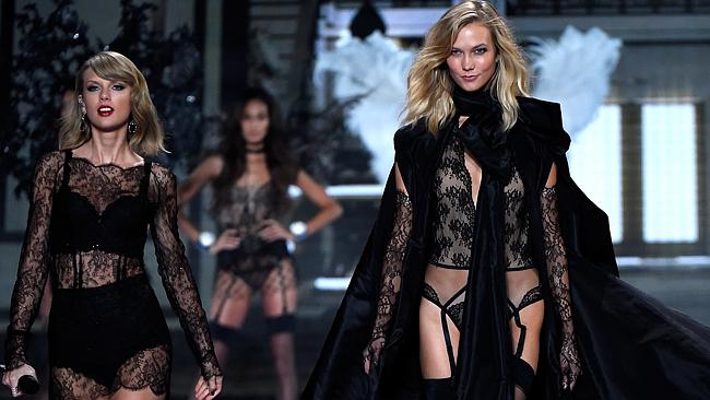 Karlie Kloss walks the runway as Taylor Swift performs at the annual Victoria’s Secret fa