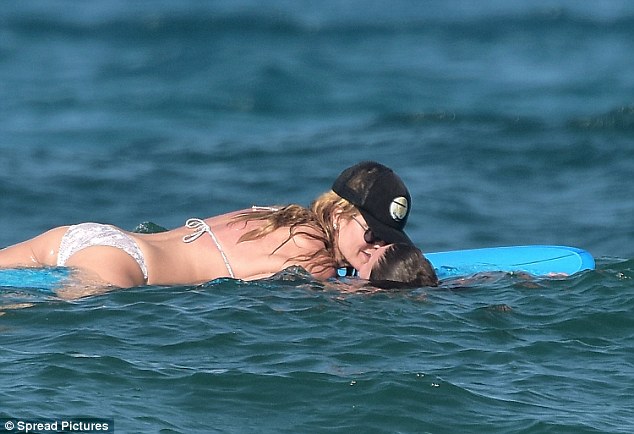 Smooch: She's been enjoying a romantic break with boyfriend Vito Schnabel, 29, in St Bart's