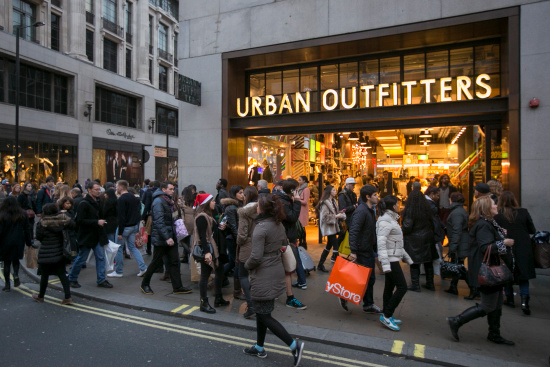 Shoppers walk outside Urban Outfitters on Dec. 14, 2013 in London.