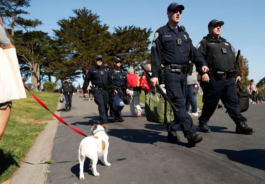 San Francisco Police officers walk through Alamo Square Park before the park was closed shortly before 10 am in San Francisco, Calif. on Saturday, August 26, 2017. Photo: Scott Strazzante, The Chronicle