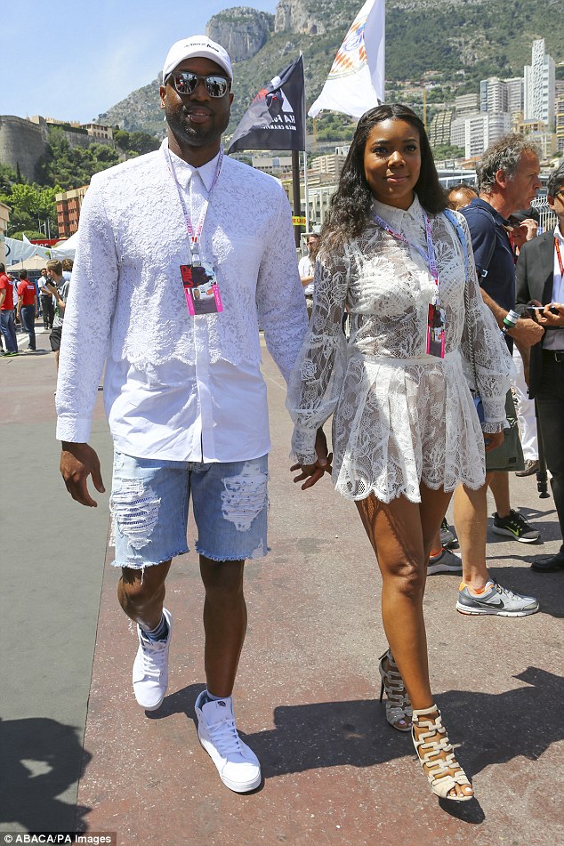 Sheer ambition: Gabrielle Union showed off her white lingerie by wearing a see-through dress while with Dwayne Wade at the Grand Prix on Saturday