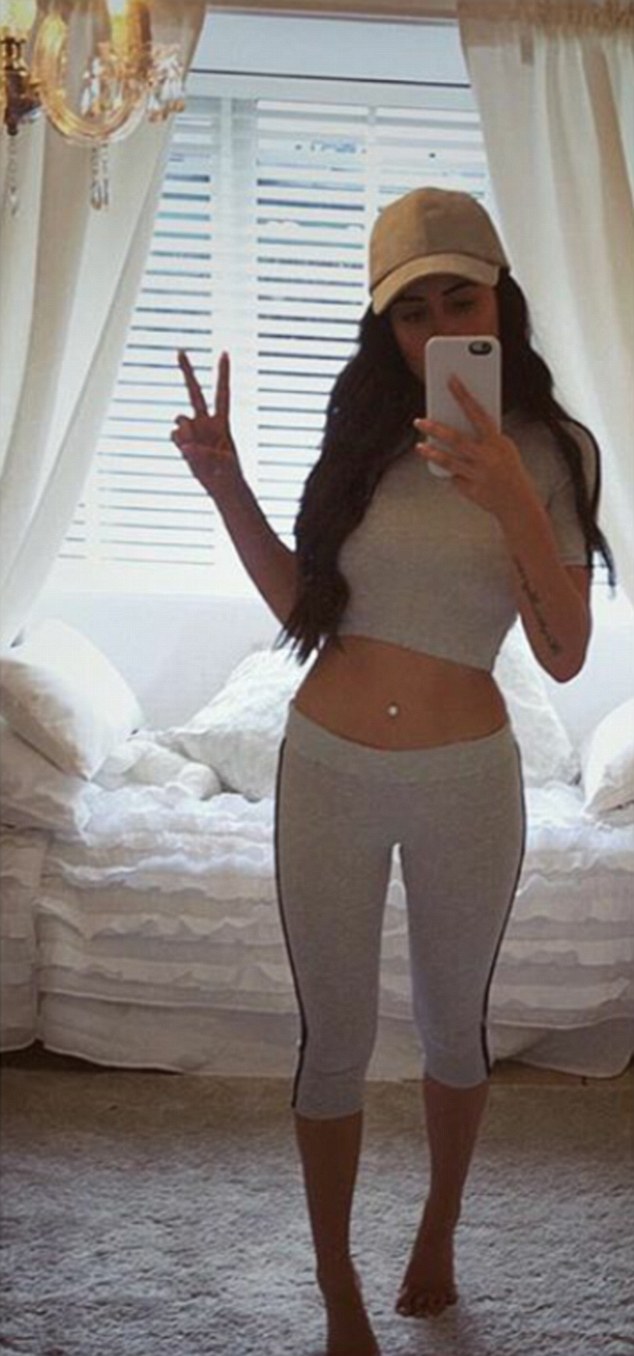 Peace: Marnie also posed in a crop top and leggings during her relaxed weekend