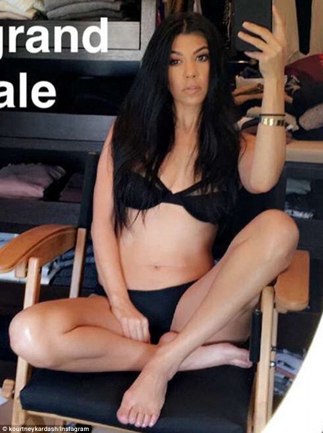 Going for it: Kourtney Kardashian posted a daring selfie on Tuesday where she was opening her legs while wearing nothing but black lingerie