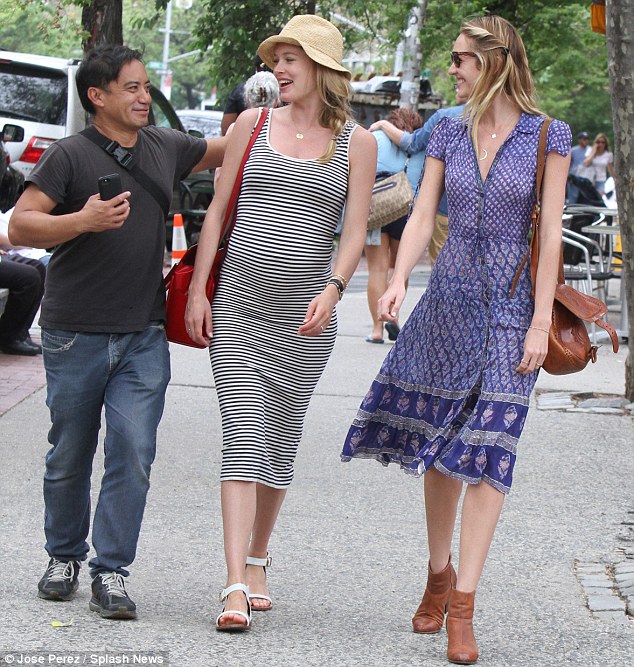 Making a new friend: The Angels chatted with a fan who ran up to them in the street