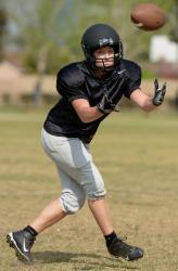 IN STRIDEmdash;Misty Goodnight catches a pass at Wolfpack practice. Goodnightrsquo;s son Riley, 10, will cheer for his mom this season. 