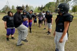 TEACHING FUNDAMENTALSmdash;Ventura County Wolfpack defensive coordinator Kevin Taylor, second from left, talks to his players during practice last weekend at Rio Lindo Park in Oxnard. 