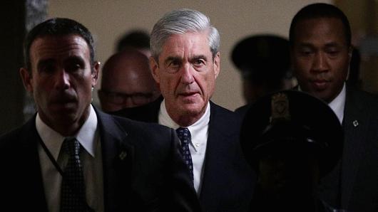 Special counsel Robert Mueller (2nd L) leaves after a closed meeting with members of the Senate Judiciary Committee June 21, 2017 at the Capitol in Washington, DC.