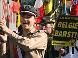 Members of the Flemish nationalist group Voorpost (Outpost) carrying a symbolic coffin of Belgium during a demonstration for independence for the Flemish part of Belgium in Rhode-Saint-Genest, near Brussels, 07 October 2007. Tensions have been rising since the general elections more than three months ago, with Belgium's two largest communities Flanders and Wallonia unable to overcome their differences and form a government.                AFP PHOTO/DOMINIQUE FAGET (Photo credit should read DOMINIQUE FAGET/AFP/Getty Images)     FAO Amy Marley and Dan Sanderson