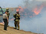 A fire at a bridge construction site on Interstate 15 that connects Southern California to Las Vegas closed the road yesterday lunchtime but officials say it may open for the evening commute.