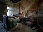 Exploring decay: Dutch photographer Niki Feijen has traversed the world looking for crumbling beauty lurking beneath a thick layer of dust inside private bedrooms and public buildings