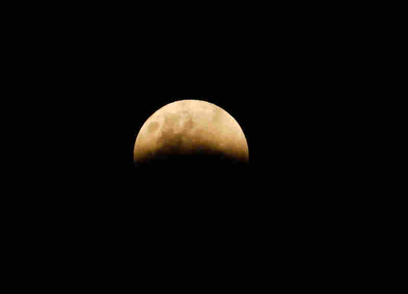 A full moon is seen during a lunar eclipse in Jakarta, Indonesia.