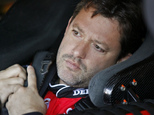 FILE - In this Oct. 29, 2010, file photo, NASCAR driver Tony Stewart sits in his car during practice for the NASCAR Sprint Cup series auto race at the Talladega Superspeedway in Talladega, Ala.  A grand jury will decide whether Stewart will be charged in the August death of fellow driver Kevin Ward at a sprint car race in upstate New York, Ontario County District Attorney Michael Tantillo announced Tuesday, Sept. 16, 2014. Ward, 20, died after being struck by Stewart's car. Ward had climbed out of his car and walked onto the dirt track to confront Stewart after he spun out while the two raced side by side. (AP Photo/Glenn Smith, File)