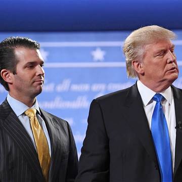 Image: Donald Trump (R) standing with his son Donald Trump Jr.