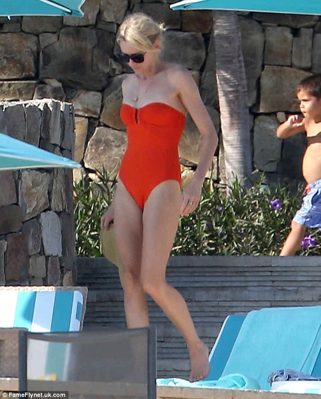 Suited up: Naomi Watts showed off her slender figure in a red strapless swimsuit on a family holiday to Mexico's Cabo San Lucas on Saturday