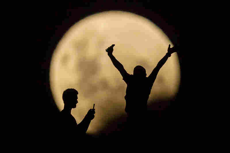 People in Lancelin, Australia, take photos of the supermoon. Last seen from Australia in December 1983.