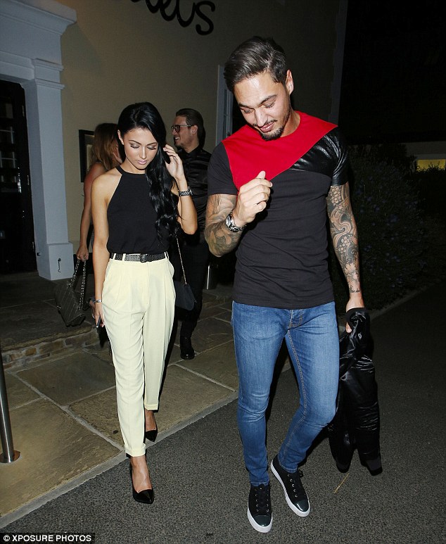 Awkward: Mario Falcone and Shelby Bingham look a little reticent to display their feelings in public as they leave the eaterie