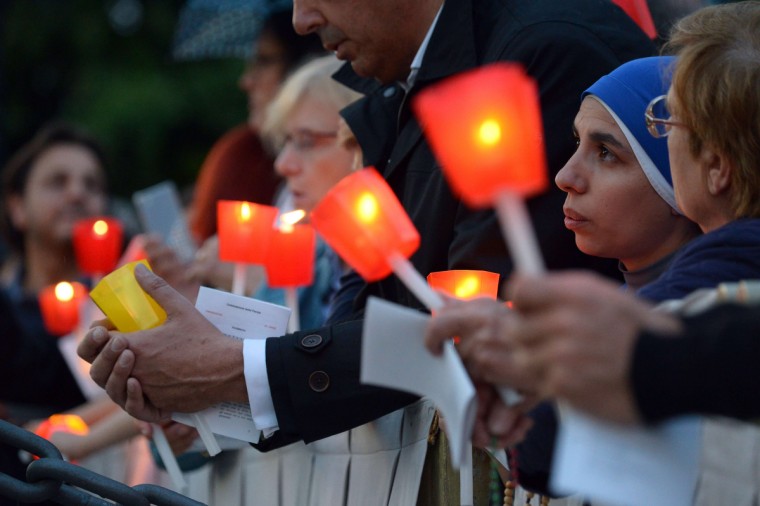 Nuns attend the celebration of a rosary event marking the closing of the Marian month at the Lourdes Grotto in the Vatican's Gardens. (Vincenzo Pinto/AFP/Getty Images)