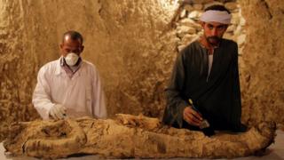 Archaeologists work on a mummy at a tomb at Draa Abul Naga necropolis on Luxors west bank, 700km south of Cairo, Egypt, 09 December 2017.