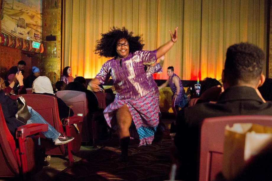 Kendra Bowman, 17, of Berkeley High School Afro-Haitian Dance performs before a screening of Black Panther at the Grand Lake Theatre in Oakland. Donations have been flowing in to bring the movie, praised for its inspirational images, to young African Americans. Photo: Santiago Mejia, The Chronicle