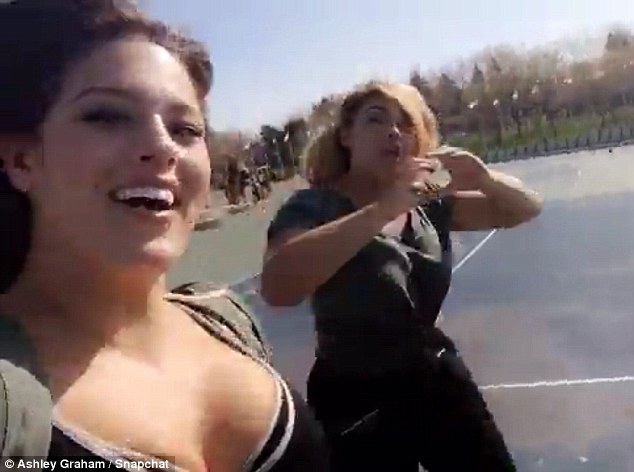 Having fun: Ashley filmed herself dancing and singing to Drake's song One Dance while they walked past a tennis court 