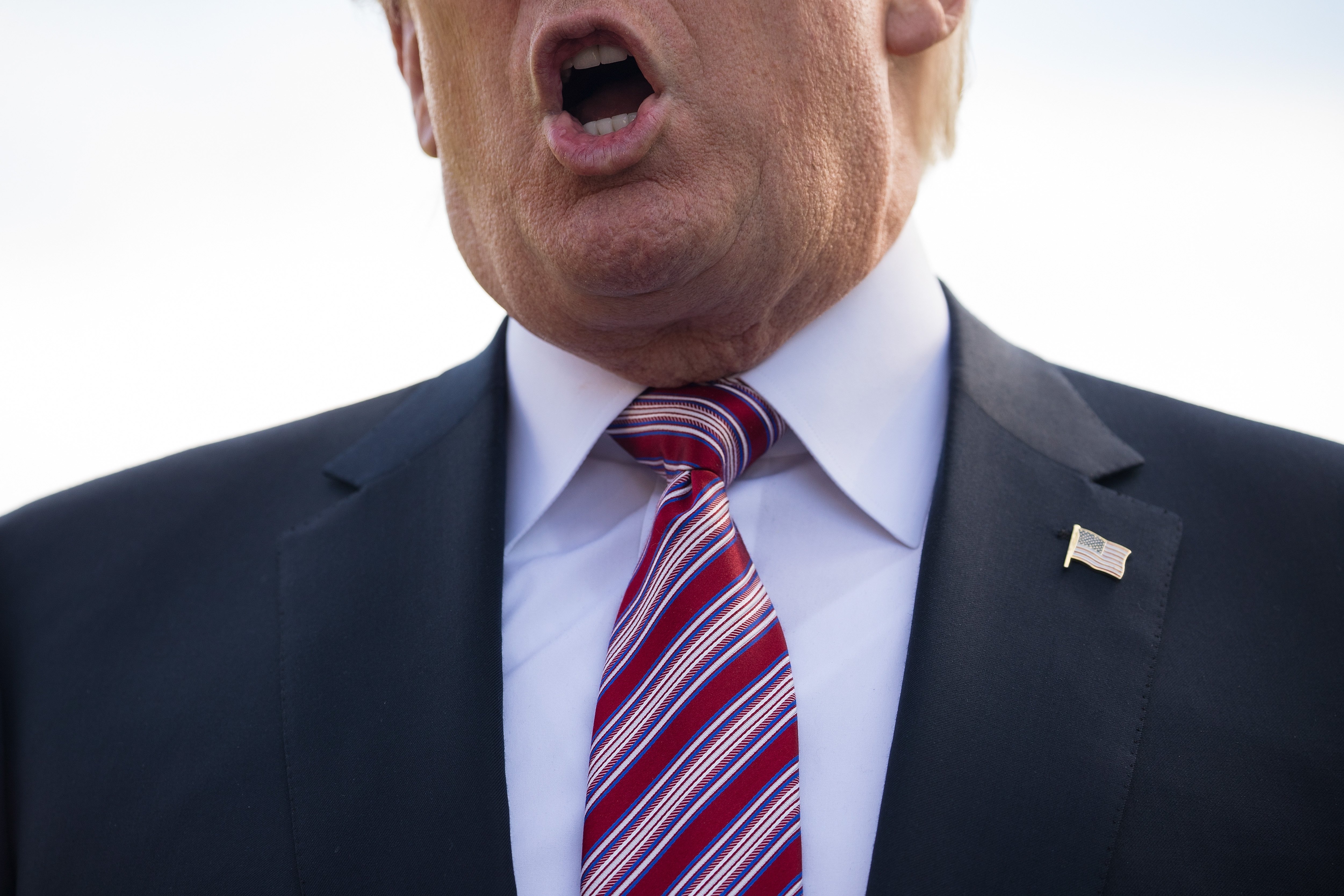 President Donald Trump takes questions from reporters before boarding Marine One on the South Lawn of the White House, Sept. 29, 2017. (Credit: Drew Angerer / Getty Images)