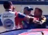 Fight: In another incident, Stewart (right) approached and punched fellow racer Joey Logano