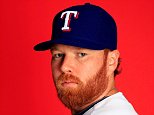 SURPRISE, AZ - FEBRUARY 25:  Pitcher Tommy Hanson #19 poses during Texas Rangers photo day on February 25, 2014 in Surprise, Arizona.  (Photo by Jamie Squire/Getty Images)