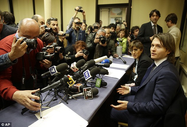 Raffaele Sollecito (right) flanked by his lawyer Giulia Bongiorno, talks to the media during a press conference in Rome. He described the ruling as an 'end to the nightmare'