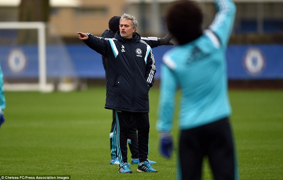 The Chelsea manager issues instructions to his players during Friday morning's training session ahead of the Spurs game